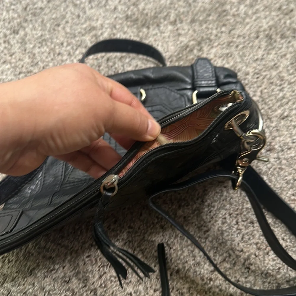 The Saks black leather cross body bag